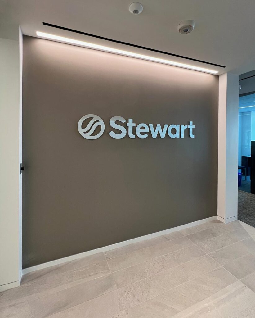 New stainless steel lobby sign at the offices of Stewart Investment Partners in Bethesda, Maryland.